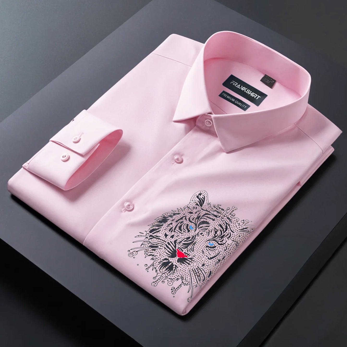 Pink dress shirt with a tiger embroidery on a dark surface