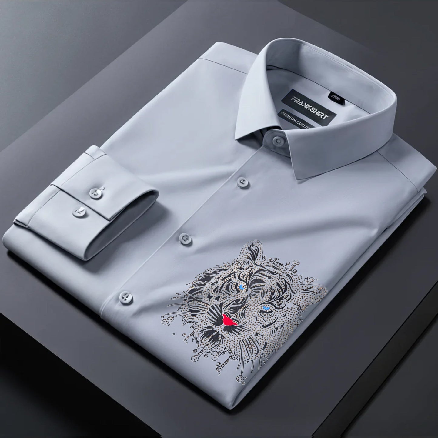 Gray dress shirt with a tiger embroidery design on a dark surface