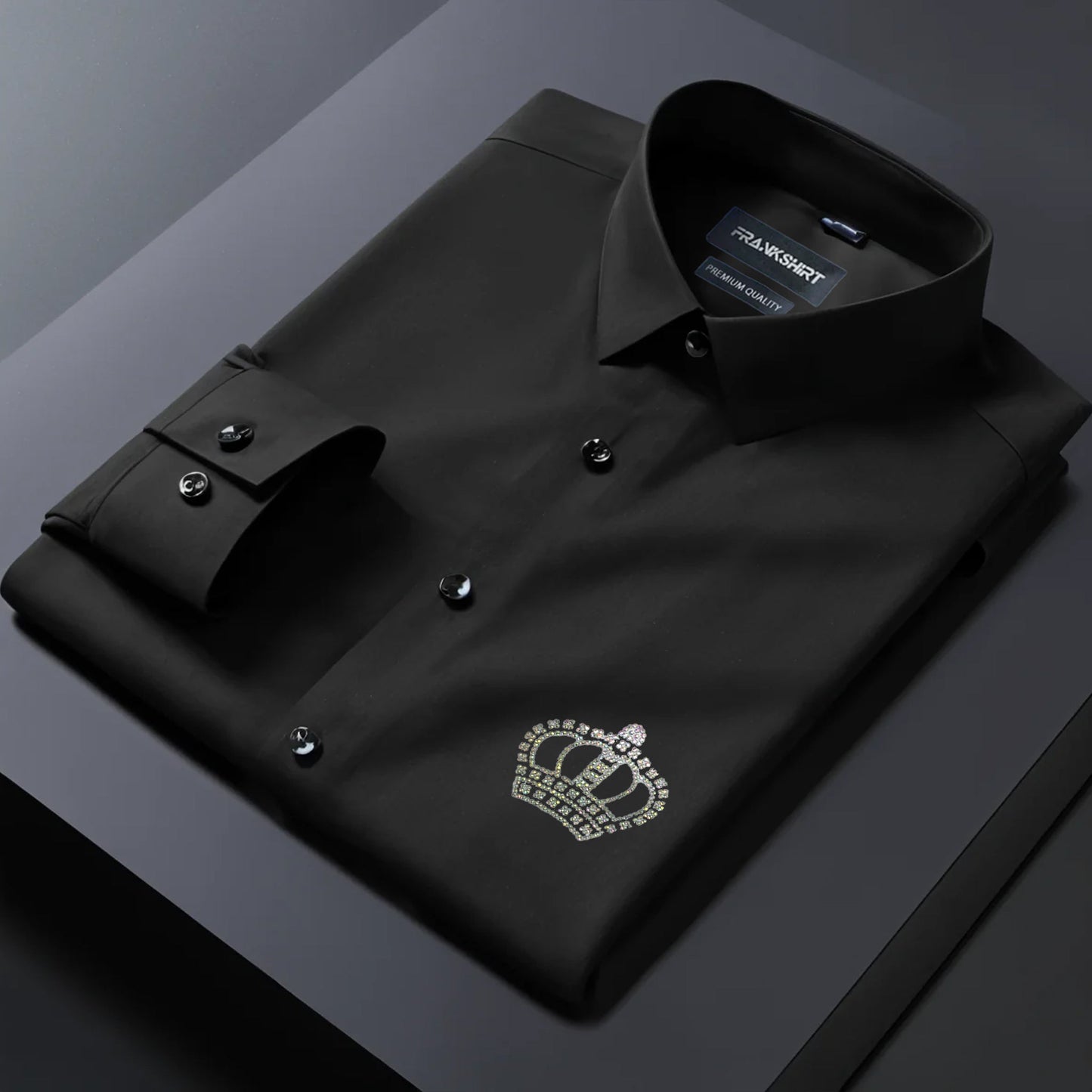 Black dress shirt with a crown emblem on a dark background
