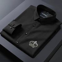 Black dress shirt with a crown emblem on a dark background