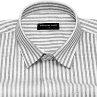 Folded striped shirt with a 'Premium Shirt' label on a white background