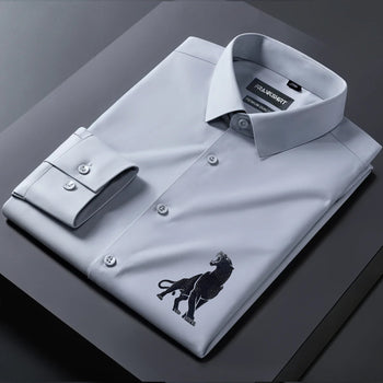 Gray dress shirt with a logo on a dark surface