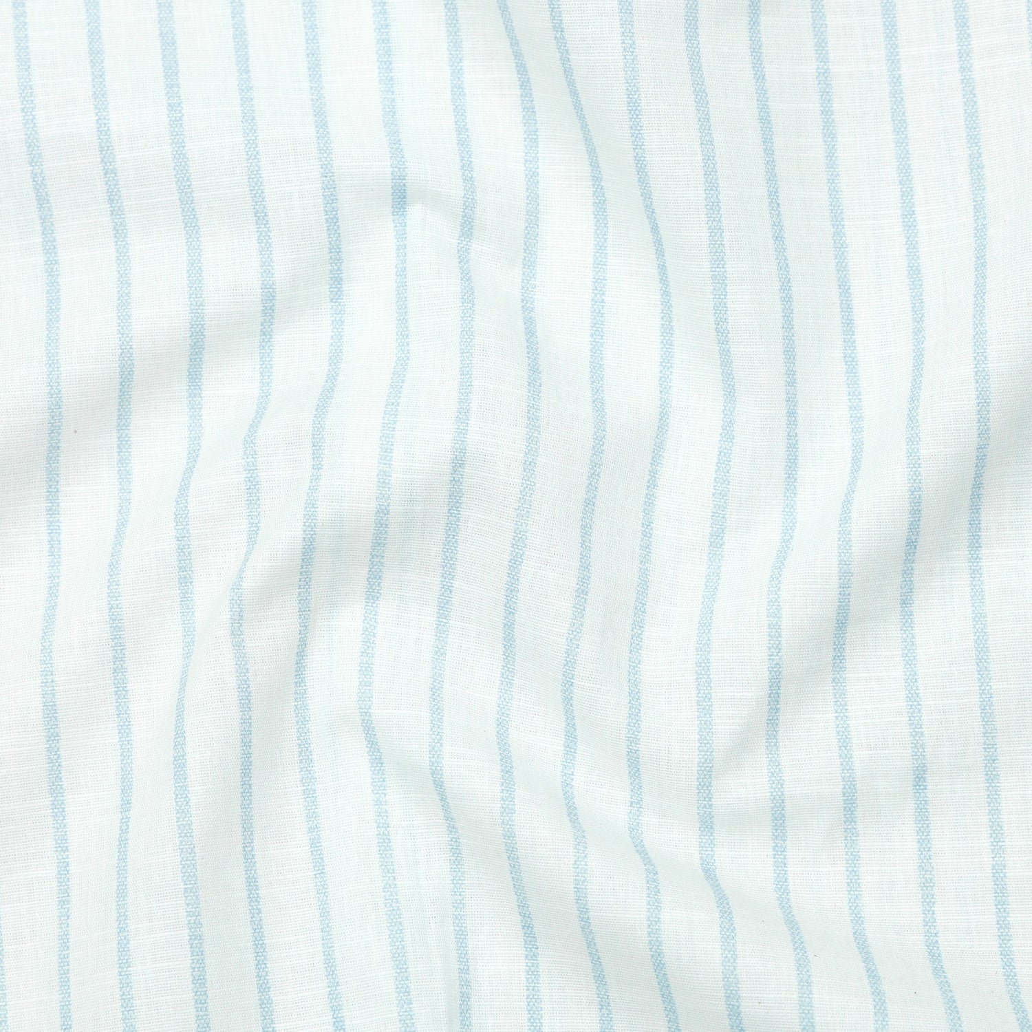 Close-up of fabric with light blue vertical stripes on a white background