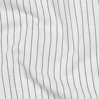 Close-up of white fabric with black parallel lines