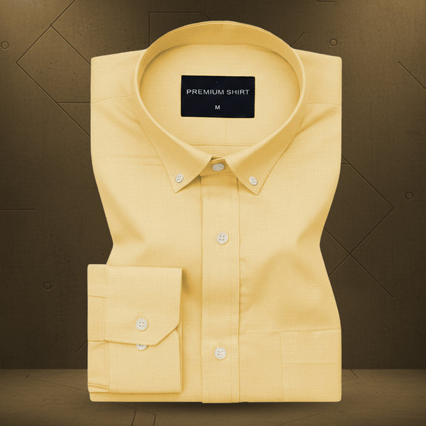 Yellow dress shirt with a 'Premium Shirt' label on a brown background