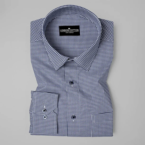 Folded checkered shirt with 'London Cotton' label on a gray background