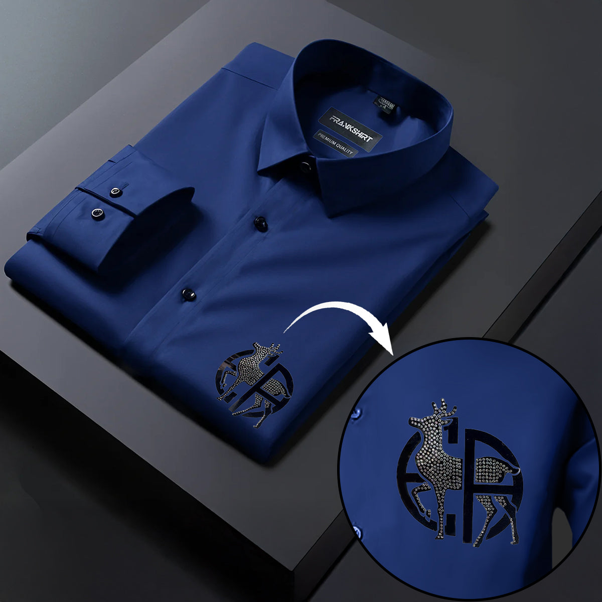 Blue dress shirt with a deer emblem on a dark background