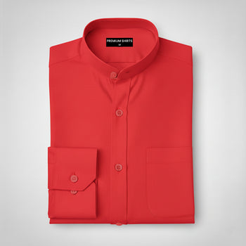 Folded red shirt with a label on a light gray background