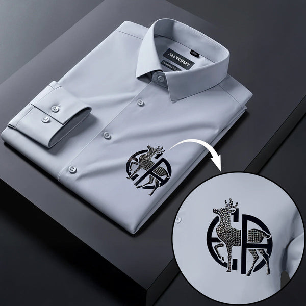 Gray dress shirt with a detailed logo on a dark surface