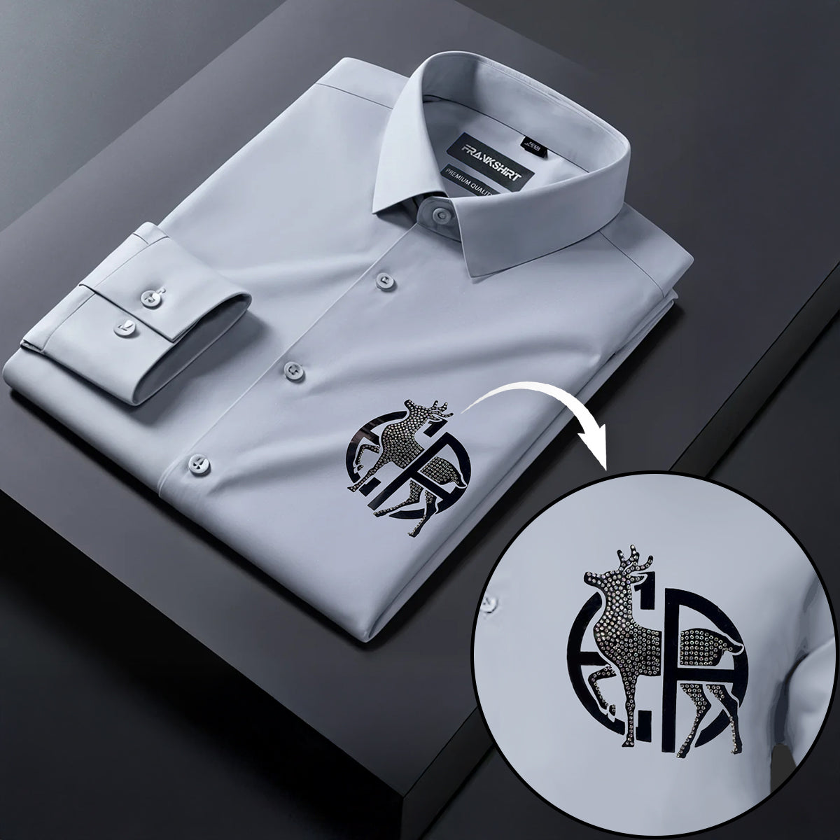 Gray dress shirt with a detailed logo on a dark surface