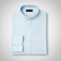 Folded light blue shirt on a gray background with 'Premium Shirts' label.